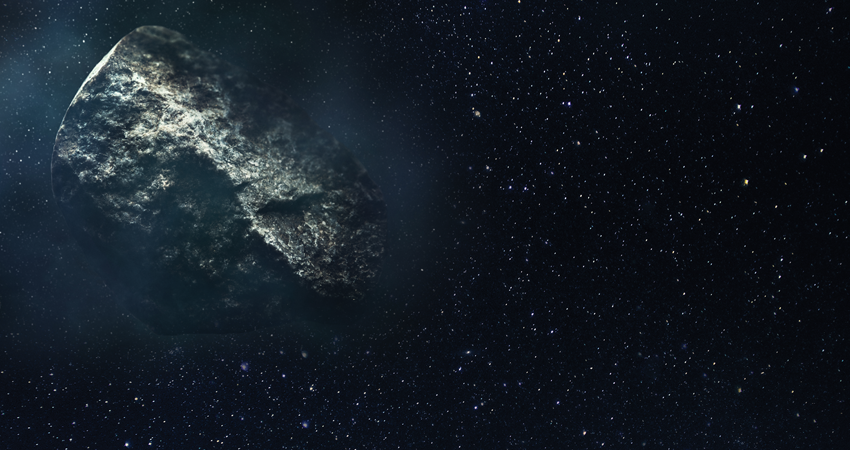 Large asteroid floating in space with a starry background.