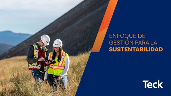 Two workers in PPE reviewing plans outdoors with a sustainability management theme.